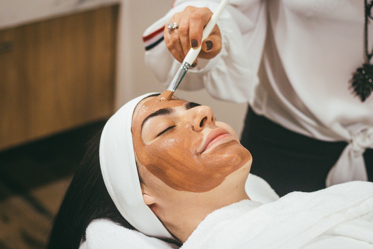 Skincare products arranged on a soft surface