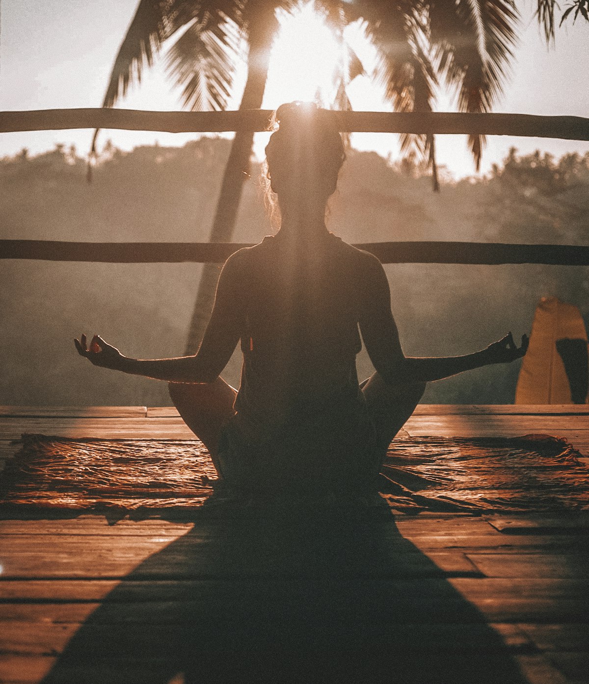 Woman meditating in a calm sunlit room